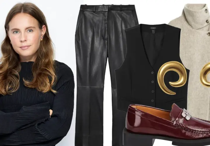 Woman in black top next to VILA leather pants, black vest, beige coat, burgundy loafers, and gold earrings.