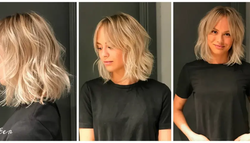 En kvinna med blont, lockigt hår och gardinlugg. Håret är stylat i en modern lob med textur.